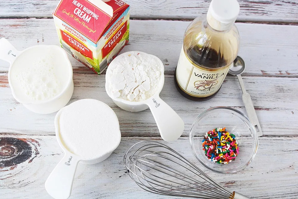 Ingredients to make birthday ice cream on a table.