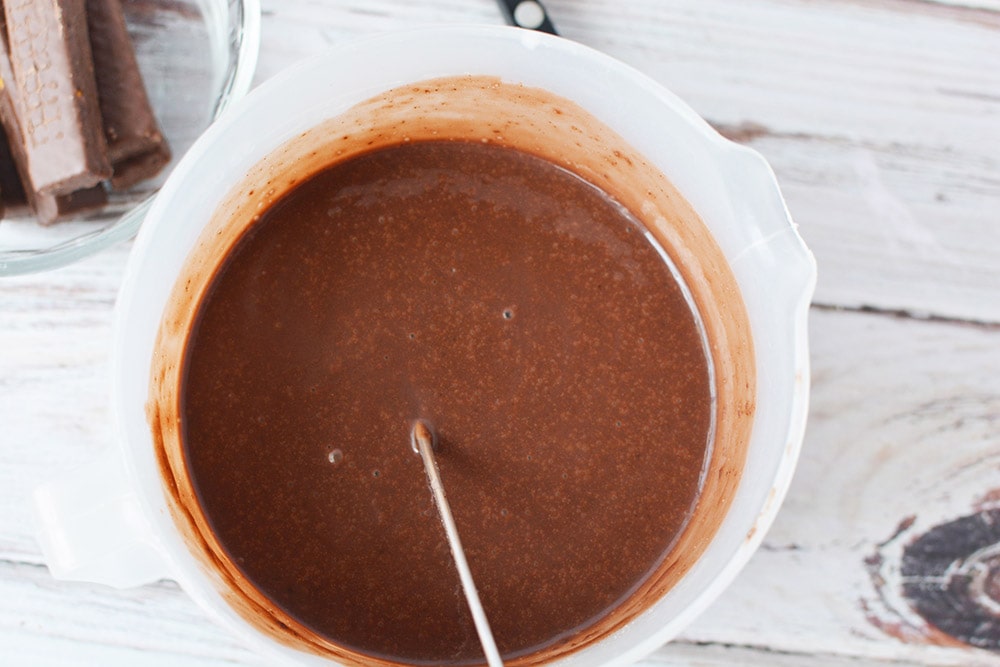 Whisking instant chocolate pudding in a bowl. 