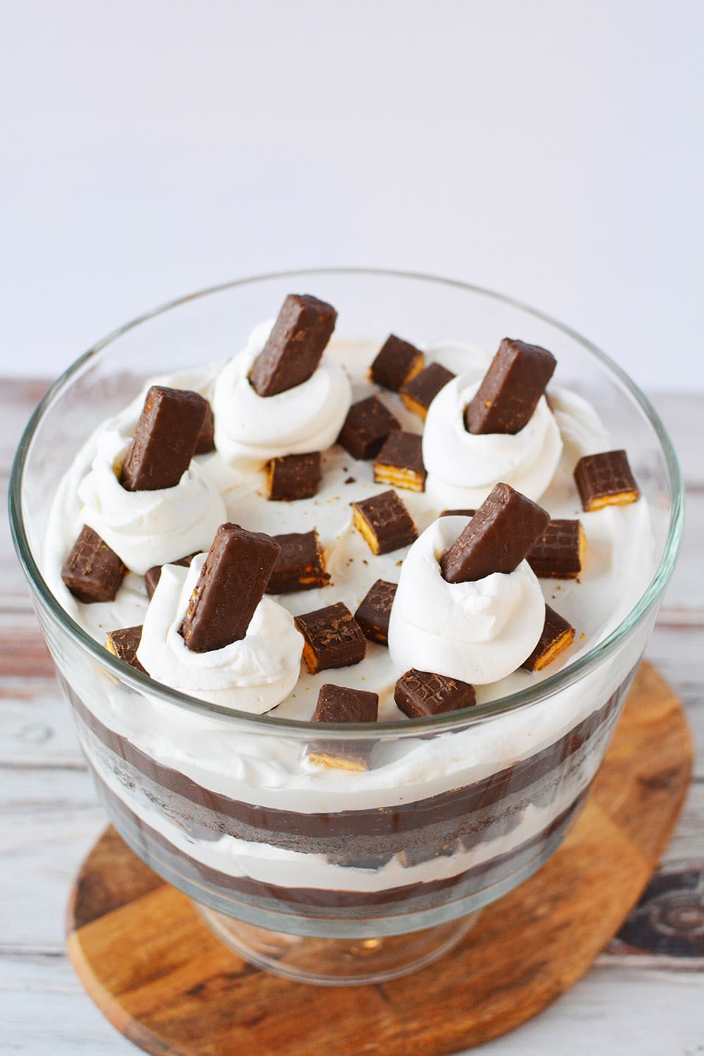 Chocolate cake trifle with fudge stick cookies in a trifle bowl. 