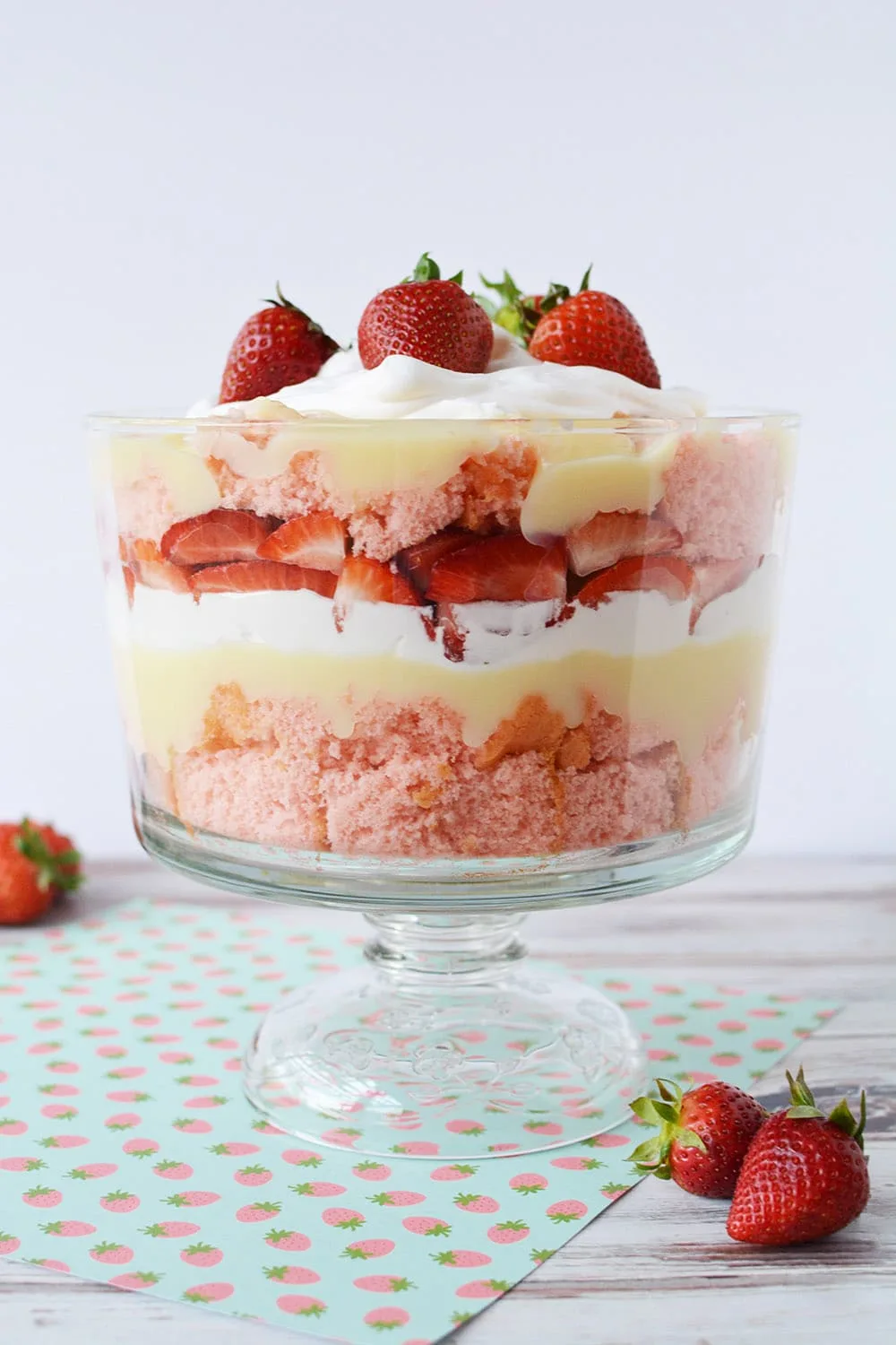Finished strawberry cheese cake trifle in a trifle bowl.