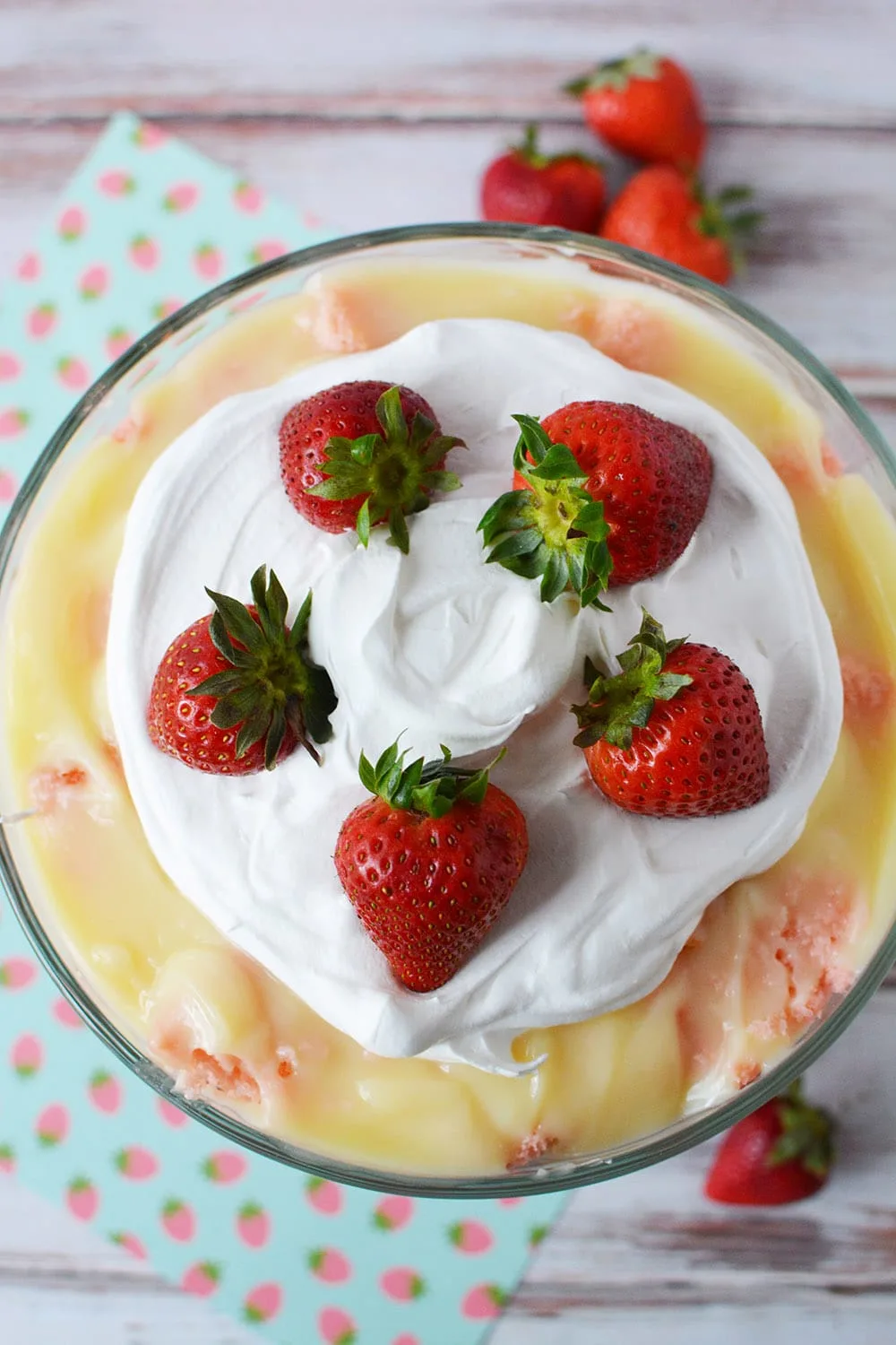 Fresh whole strawberries on top of a trifle.