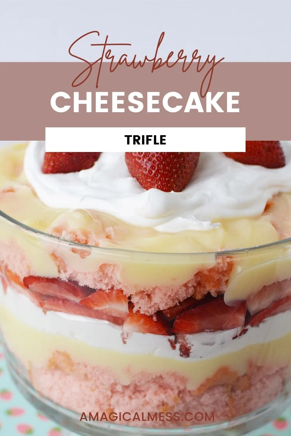a trifle bowl filled with cake, strawberries, pudding, and whipped cream