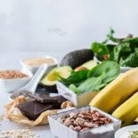 nuts, bananas, and other foods high in magnesium on a table