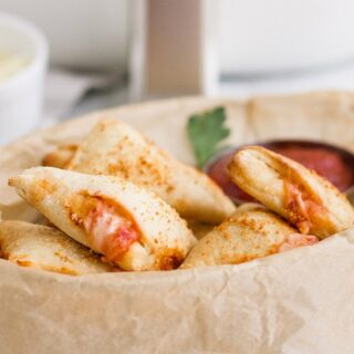 mini pizza pockets in a basket