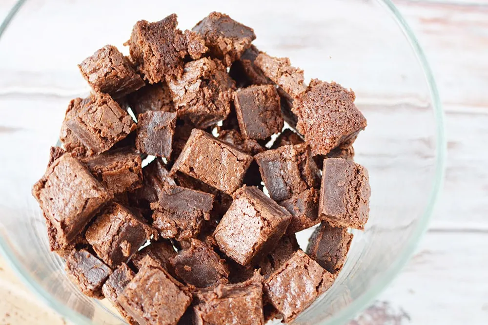 Brownie cubes in a trifle bowl.