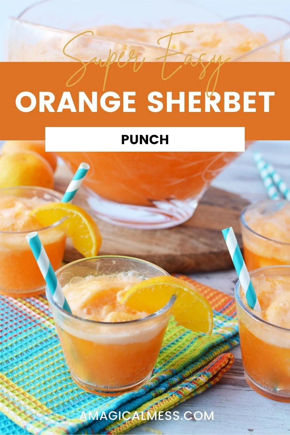 Glasses of orange sherbet punch in front of punch bowl. 