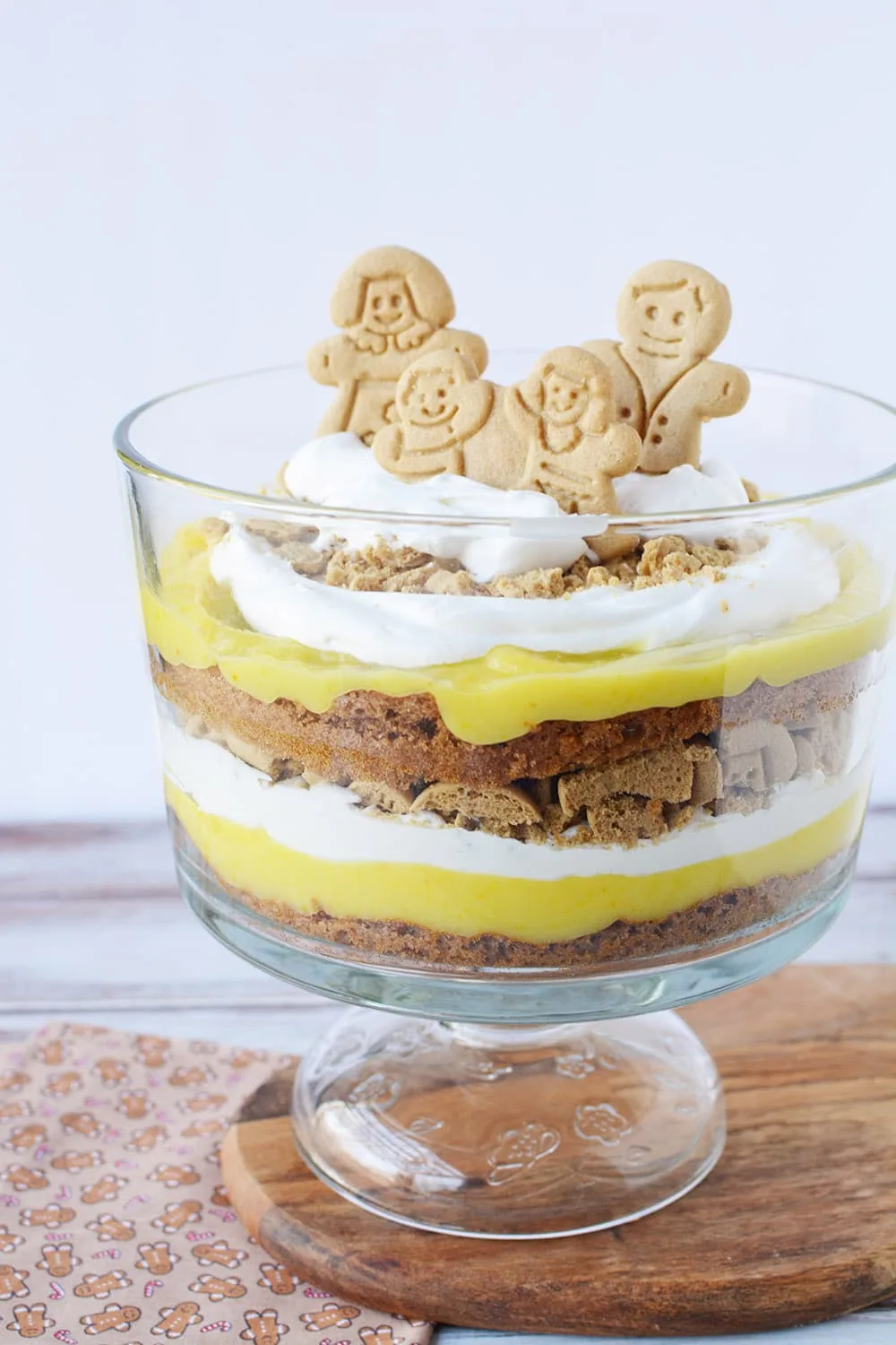 Layers of pudding, whipped cream, cookies, and cake in a gingerbread trifle. 
