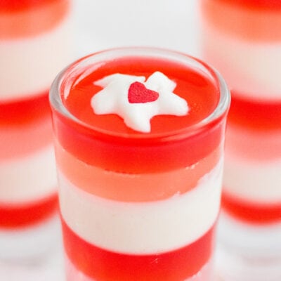 Top of layered jello with whipped cream dollop.