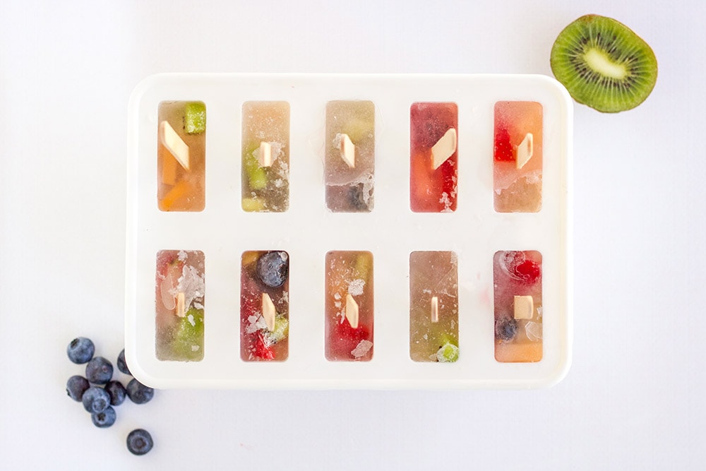 Fruit pops mix poured into a popsicle mold.