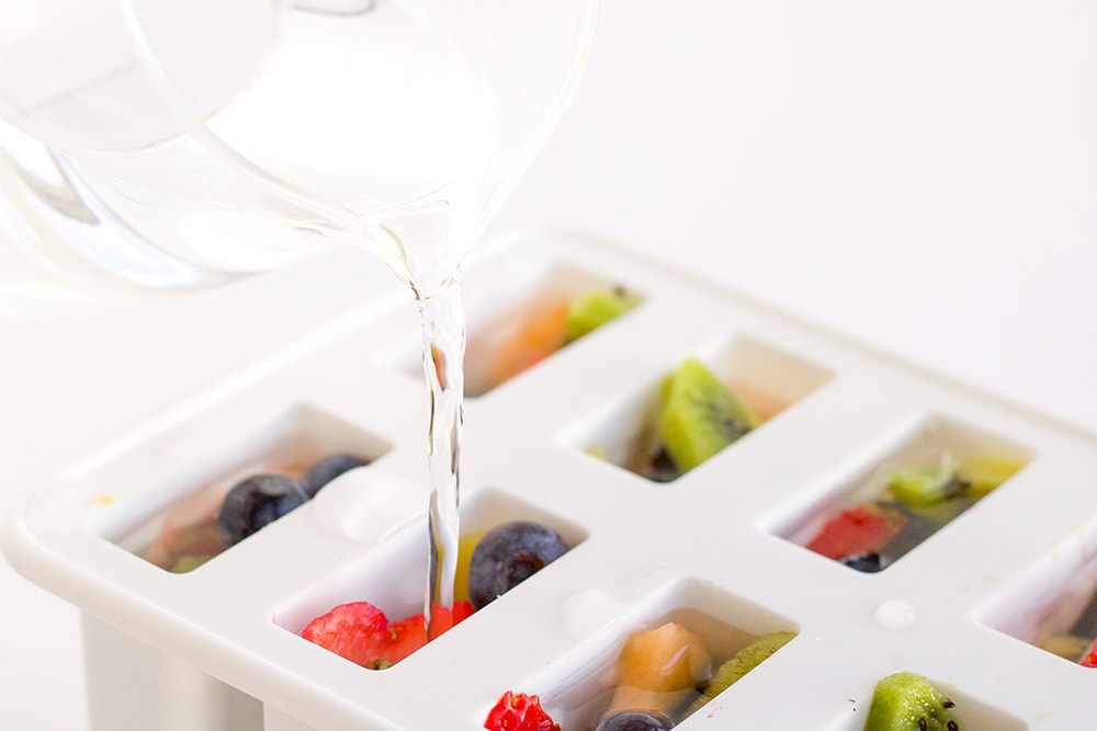 Fruit and mix in a white popsicle mold.