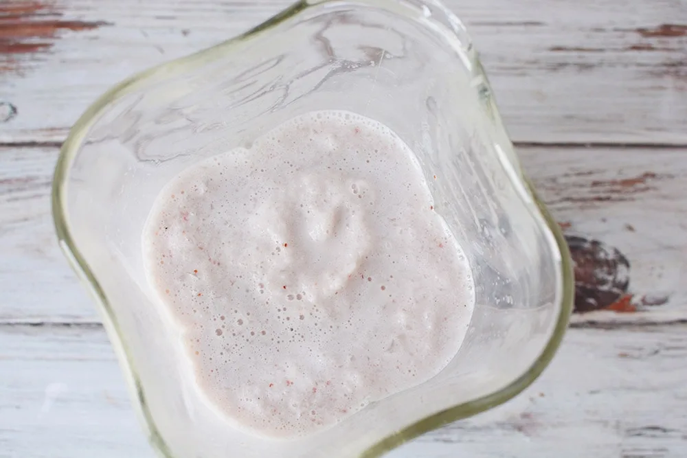 Pink shake in a blender.