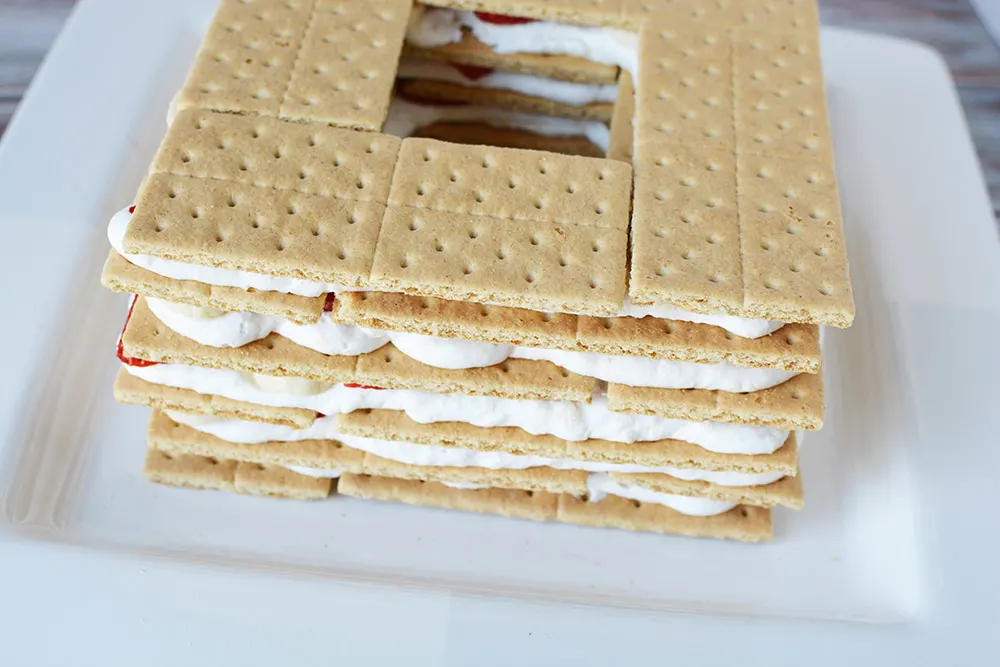 Layers of graham crackers, strawberries, and whipped cream.