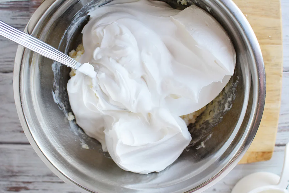 Mixing whipped topping.