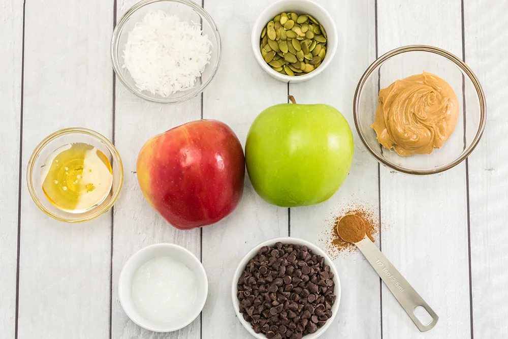 Apples, nuts, and other toppings for apple nachos.