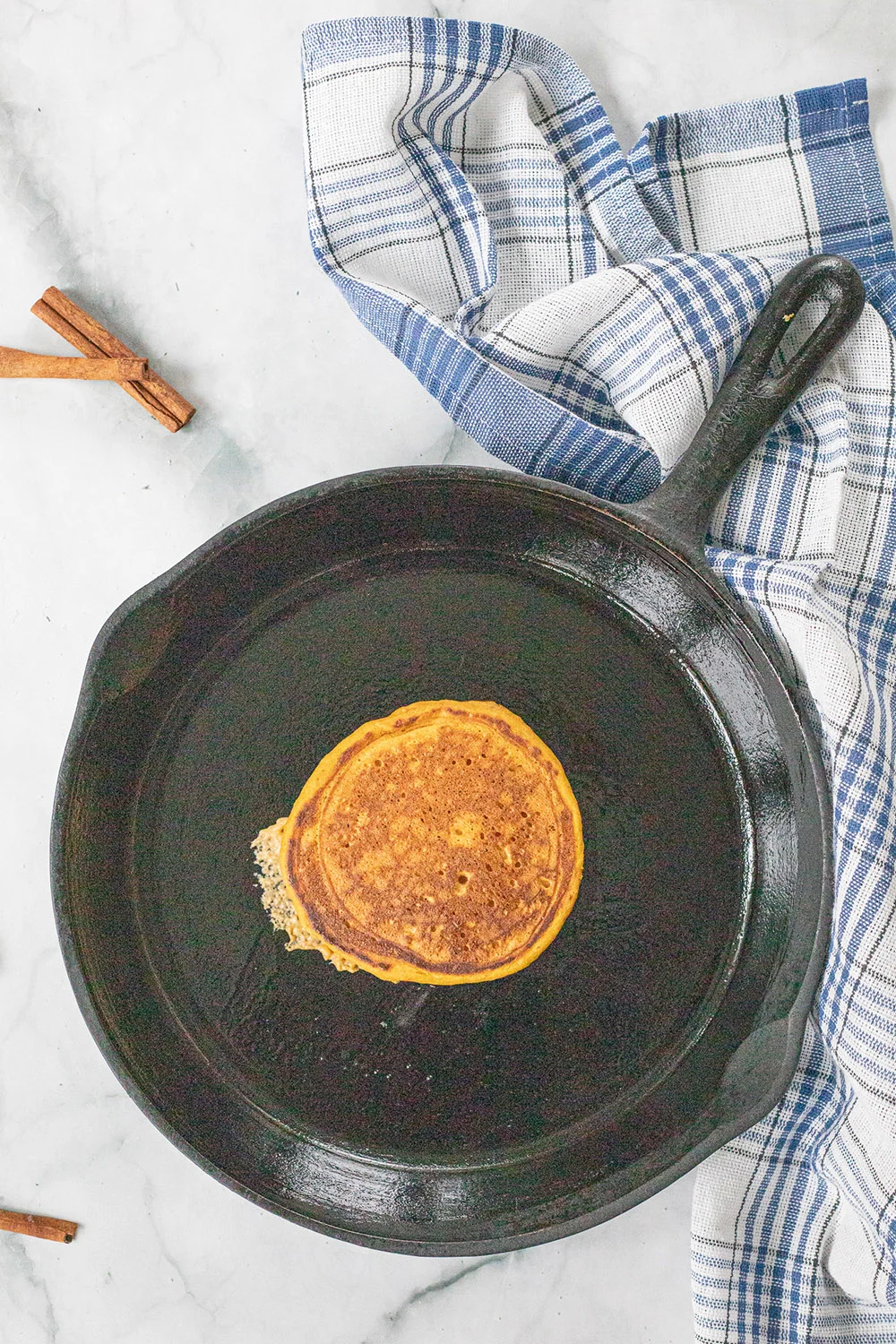 A pancake in a skillet.