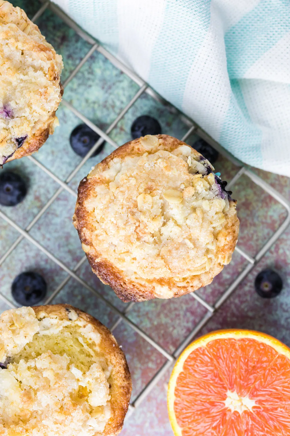 The top of muffins sitting on a cooling rack.