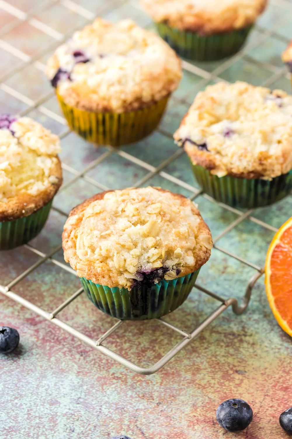 Blueberry orange muffins on a rack.
