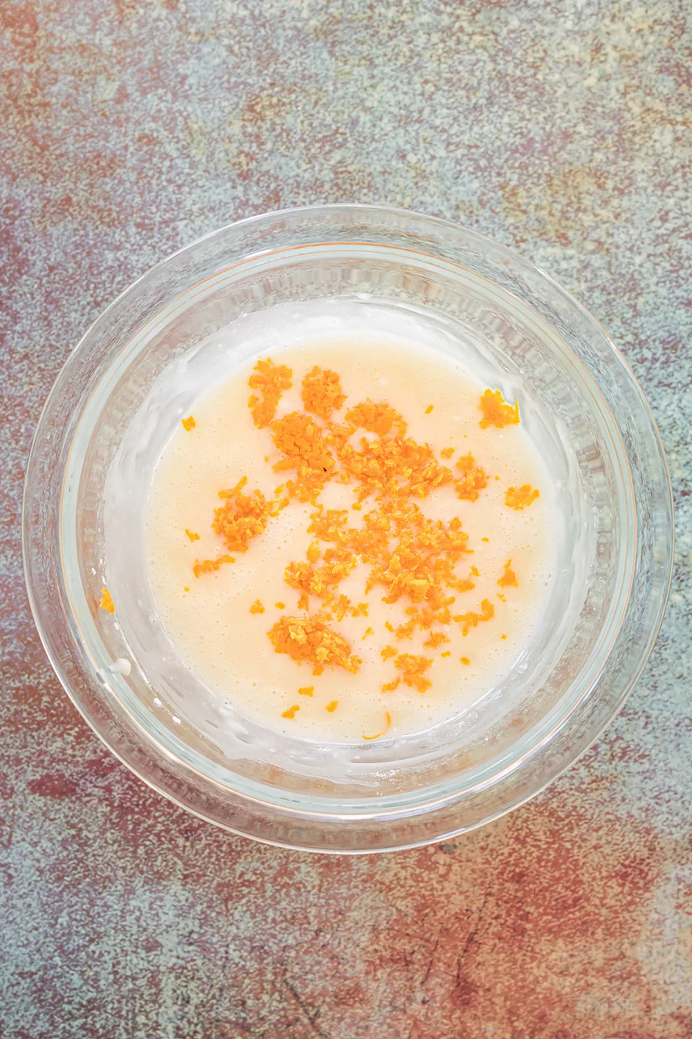 Carrot shavings in a bowl with glaze.