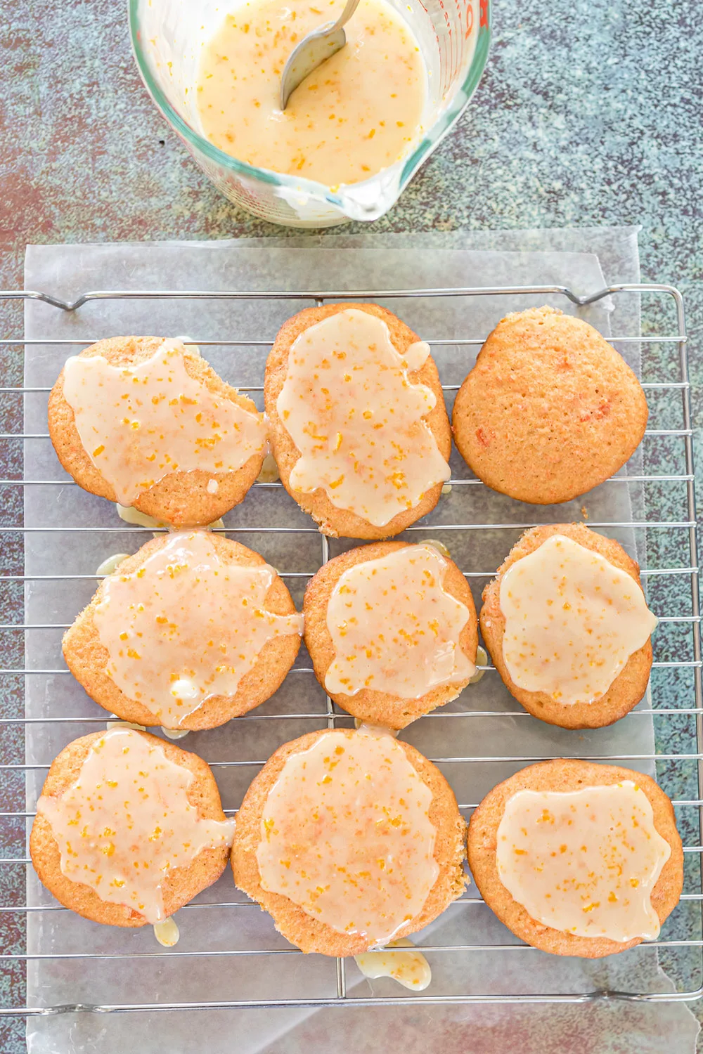 Orange cookies topped with carrot glaze.