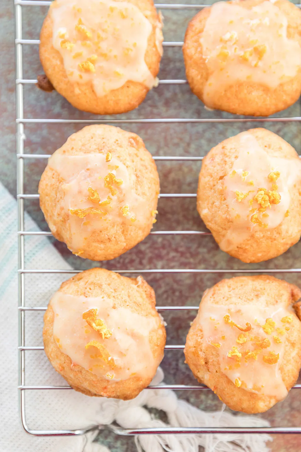 Orange juice carrot cookies on a cooling rack.