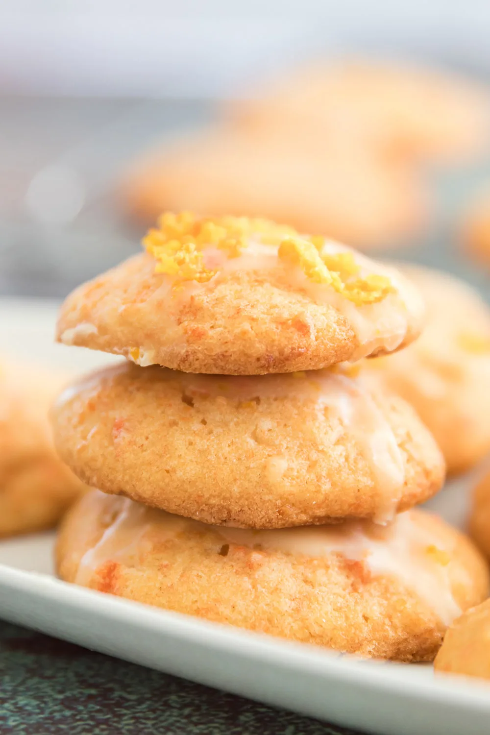 Stack of orange cookies with a carrot glaze.