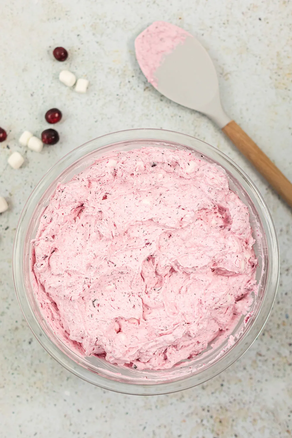 Whipping a fluffy cranberry salad.