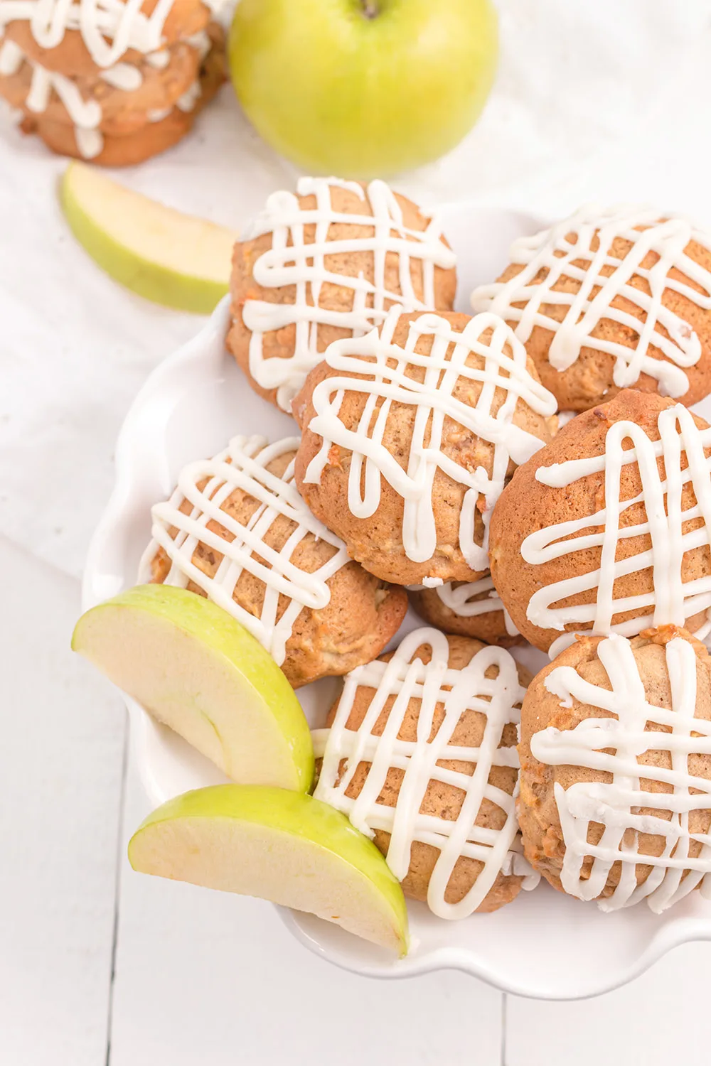 Plate full of cookies and apple slices.