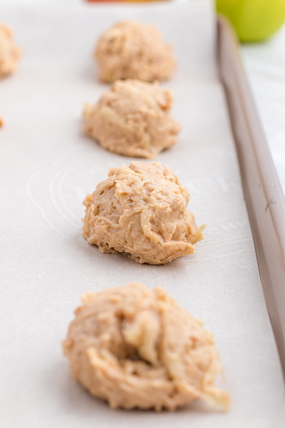 Cookie dough on a baking sheet.