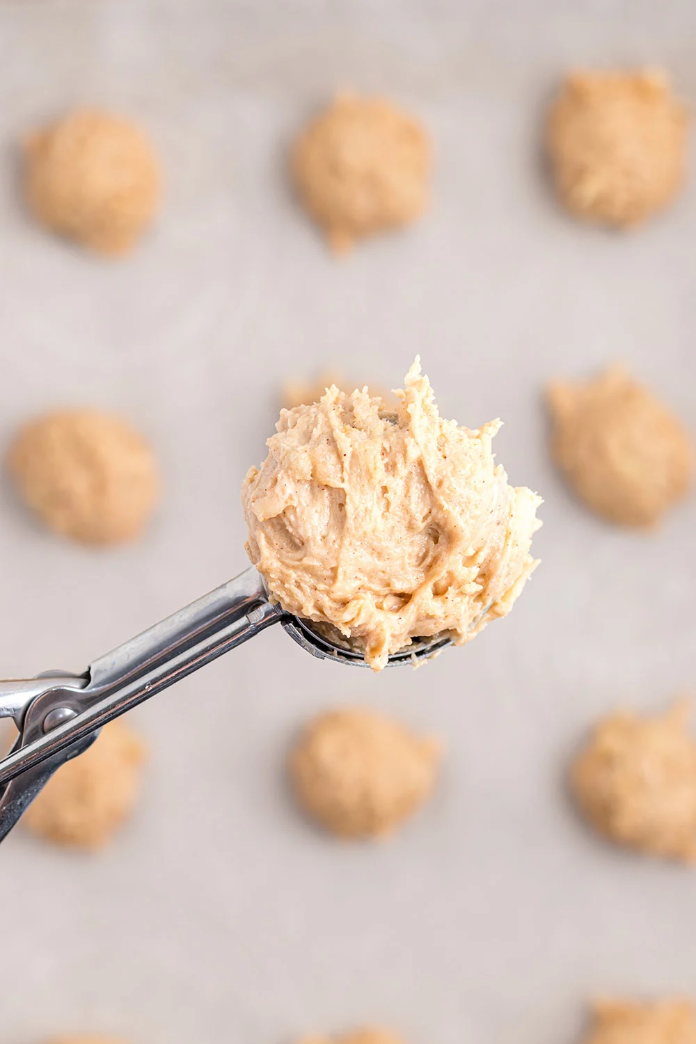 Dough in a cookie scoop.