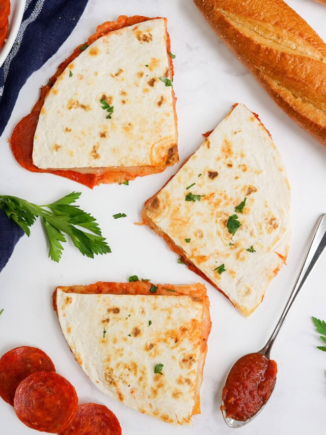 Overhead image of quesadilla slices next to bread, sauce, and pepperoni slices.