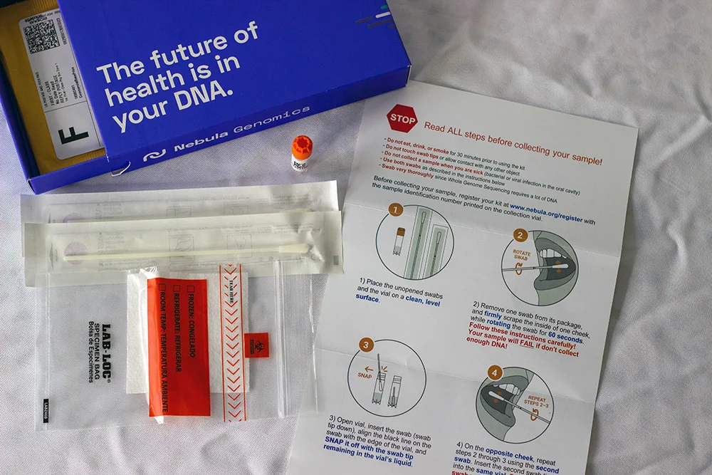 Contents of the Nebula Genomics DNA testing kit on a table.