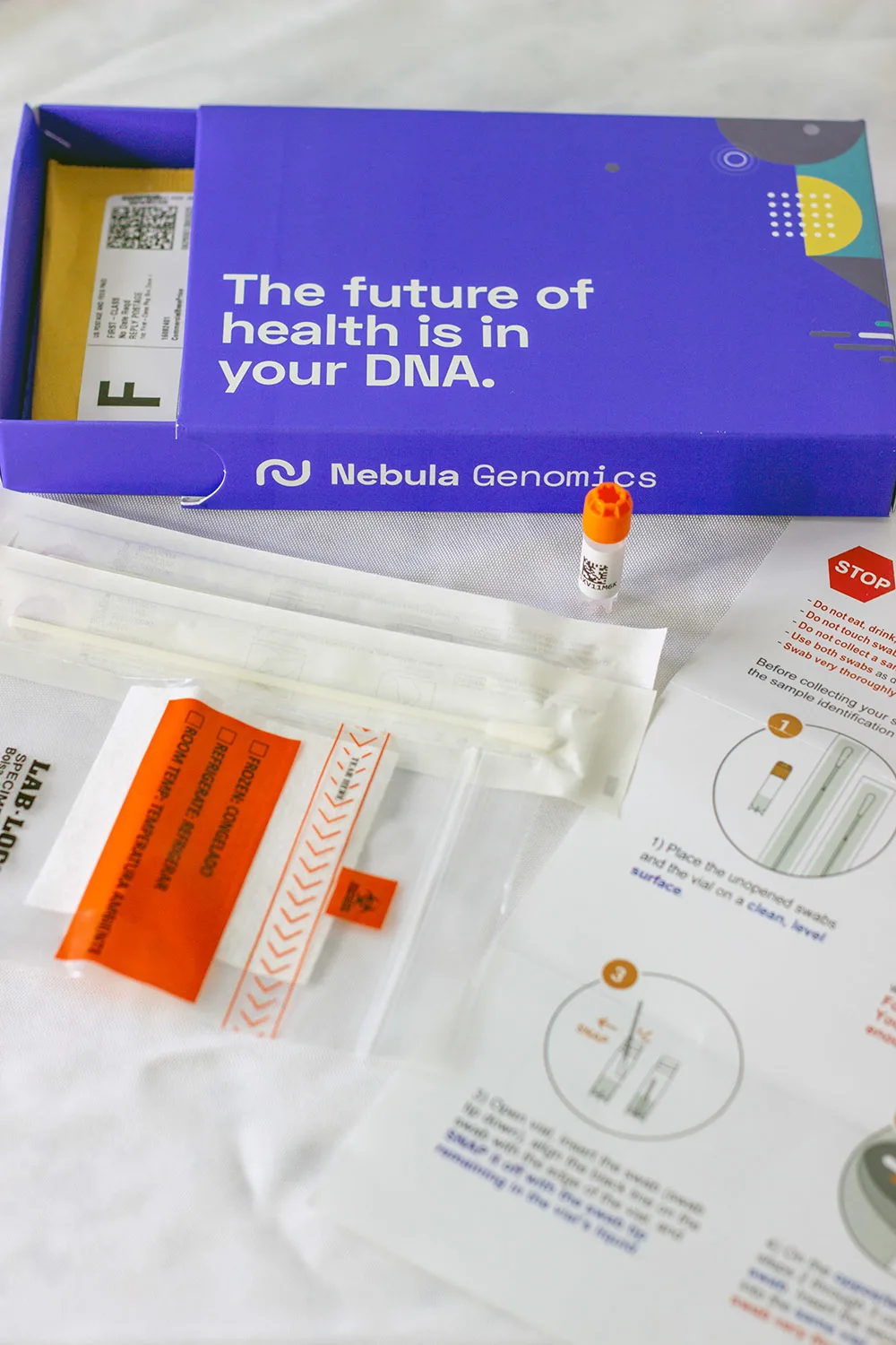 DNA test box contents on a white table.