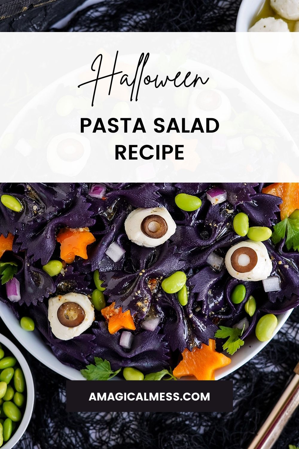 Dark pasta salad that looks like it has eyes for Halloween.