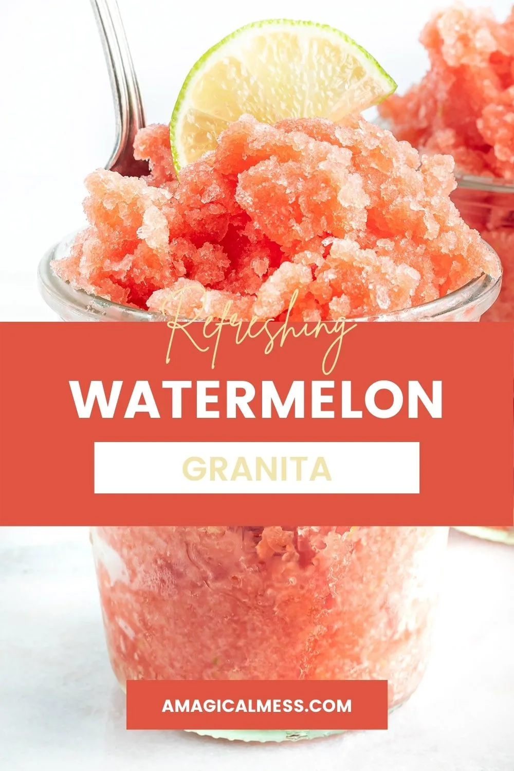 Cup full of watermelon granita with a lime on top.