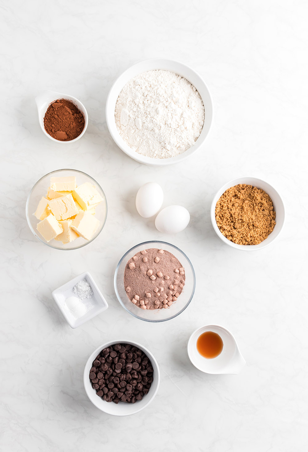 Bowls of cocoa, flour, vanilla, and other ingredients to make cookies. 