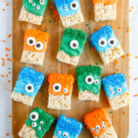 Rows of crispy treats decorated as monsters for Halloween.