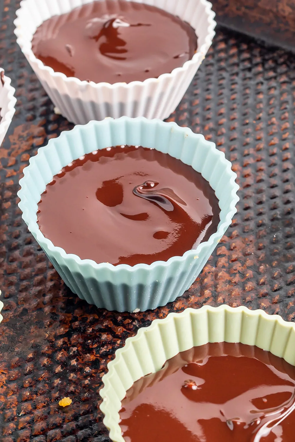 Melted chocolate in cupcake liners. 