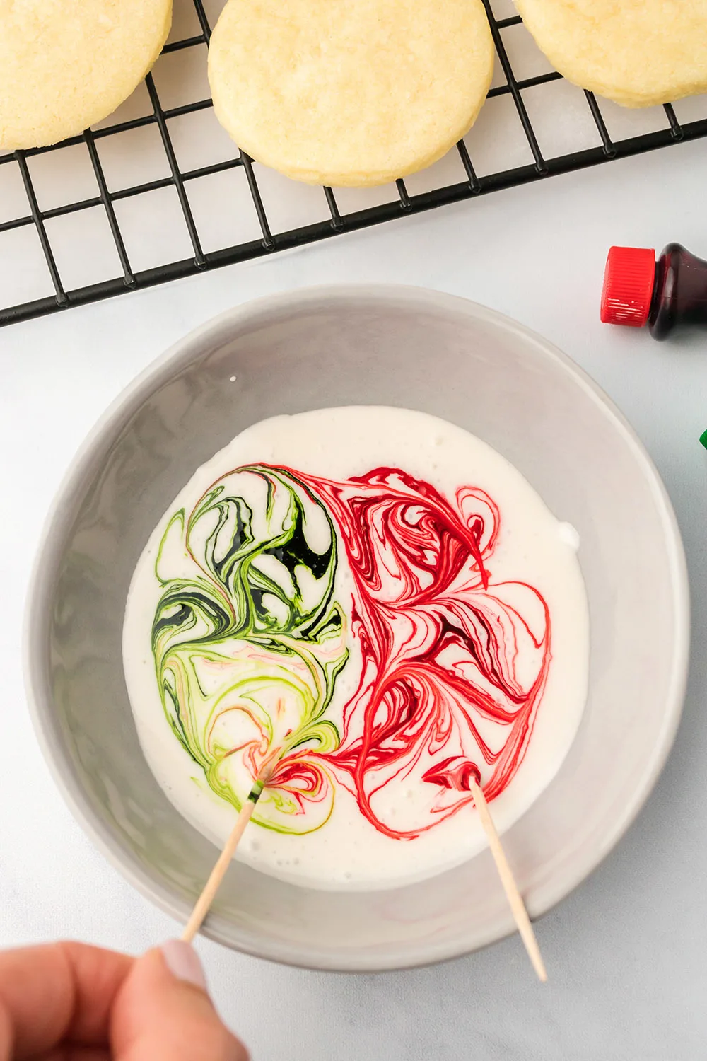 Red and green food coloring swirled in icing. 