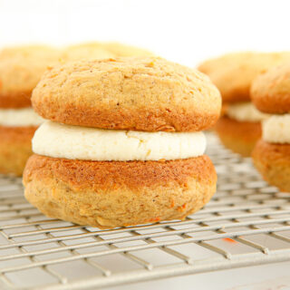 Carrot whoopie pies on a rack.