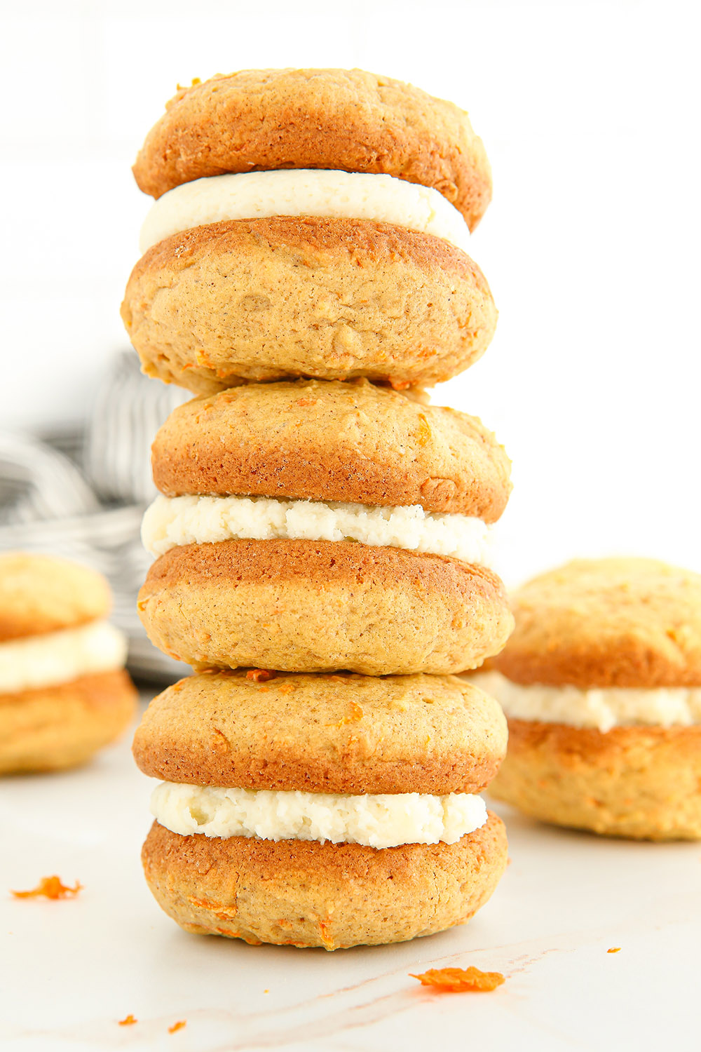 Stacked carrot whoopie pies with cream cheese filling. 