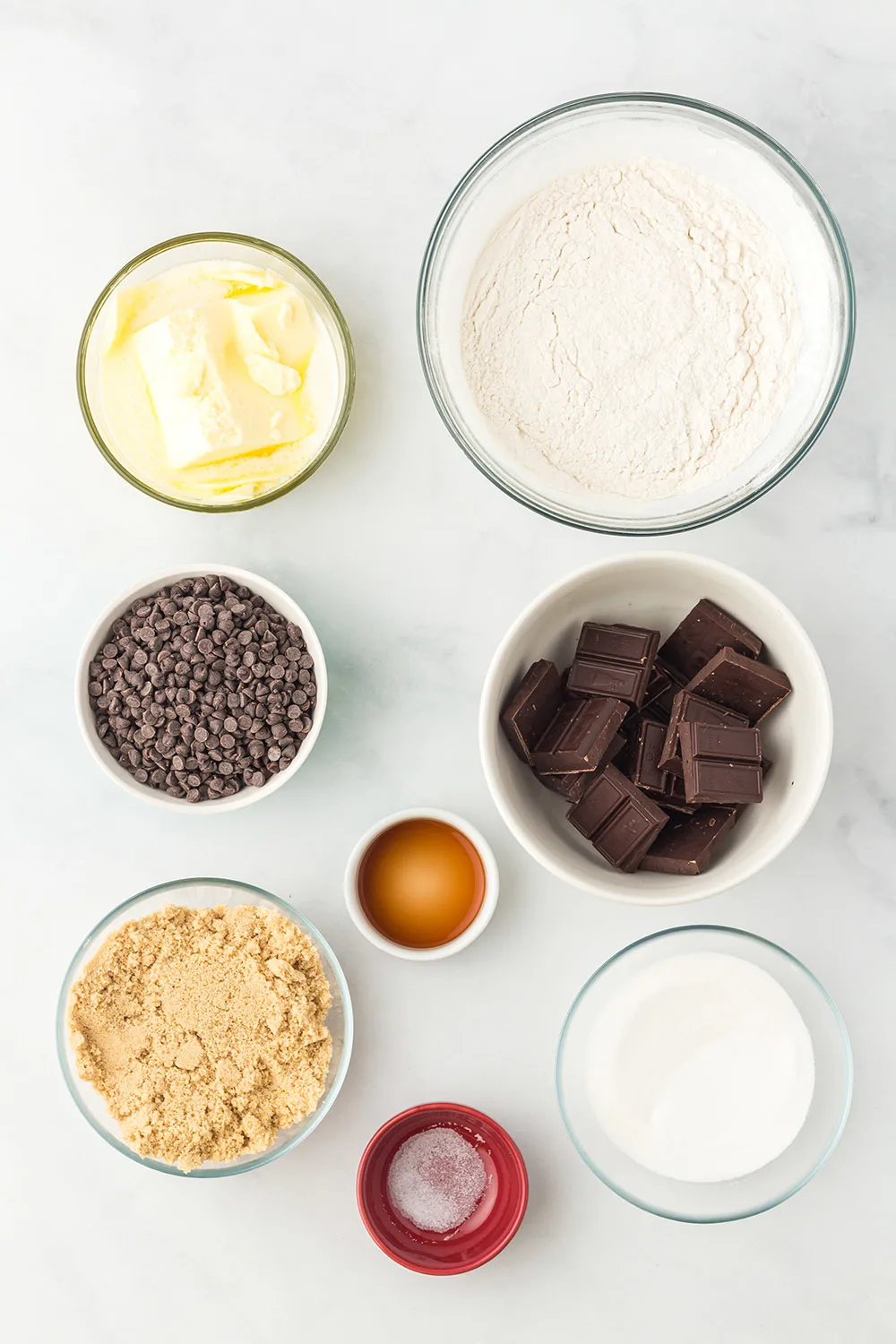 Butter, chocolate chips, and other ingredients in bowls.