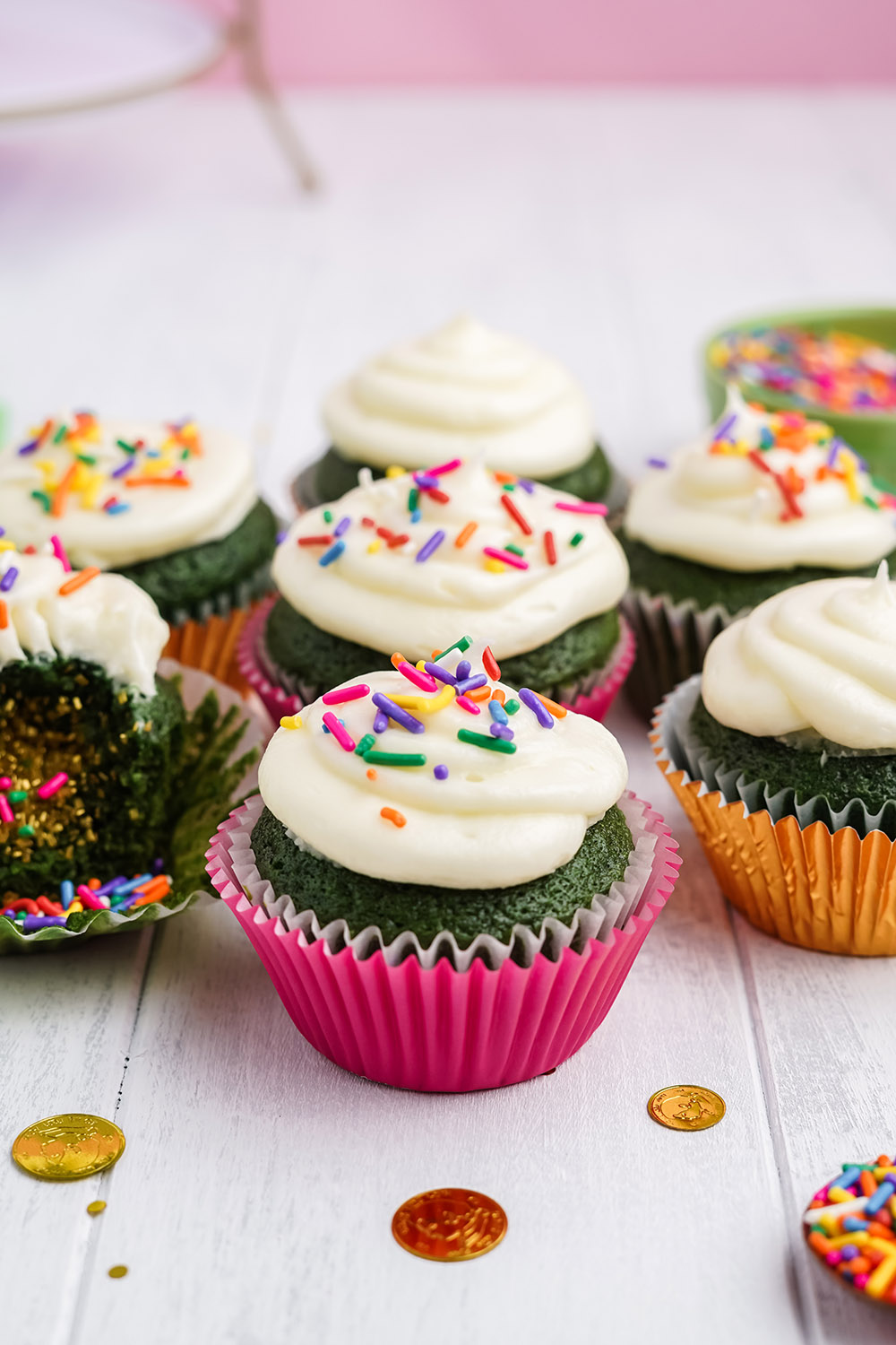 Green cupcakes with sprinkles.