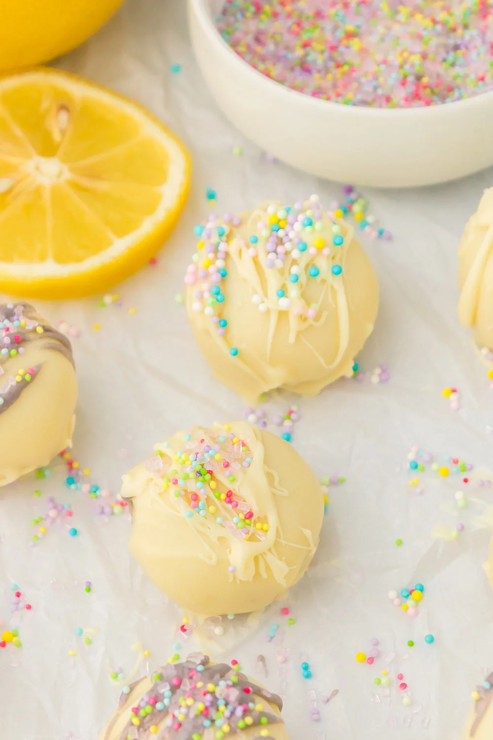 Lemon oreo truffles topped with spring colored sprinkles.