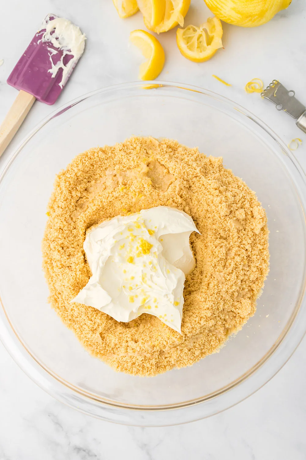 Cream cheese on top of processed lemon oreo cookies.