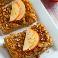 Baked oatmeal with apples on a tray.