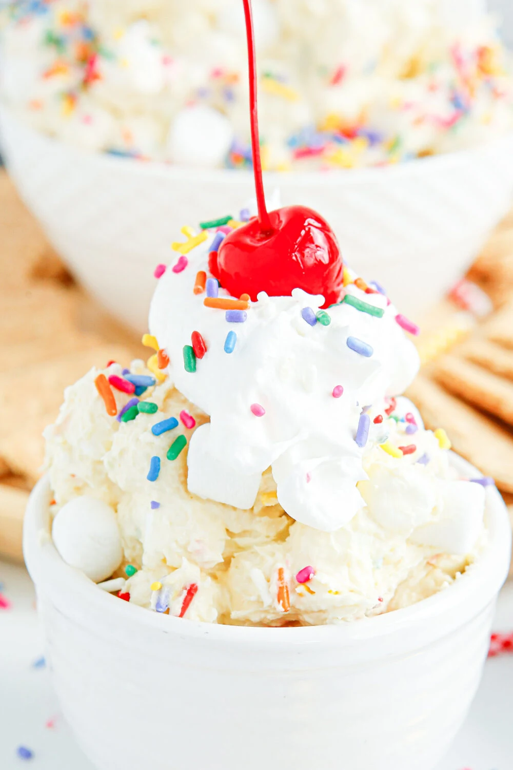 Birthday fluff topped with whipped cream and a cherry. 