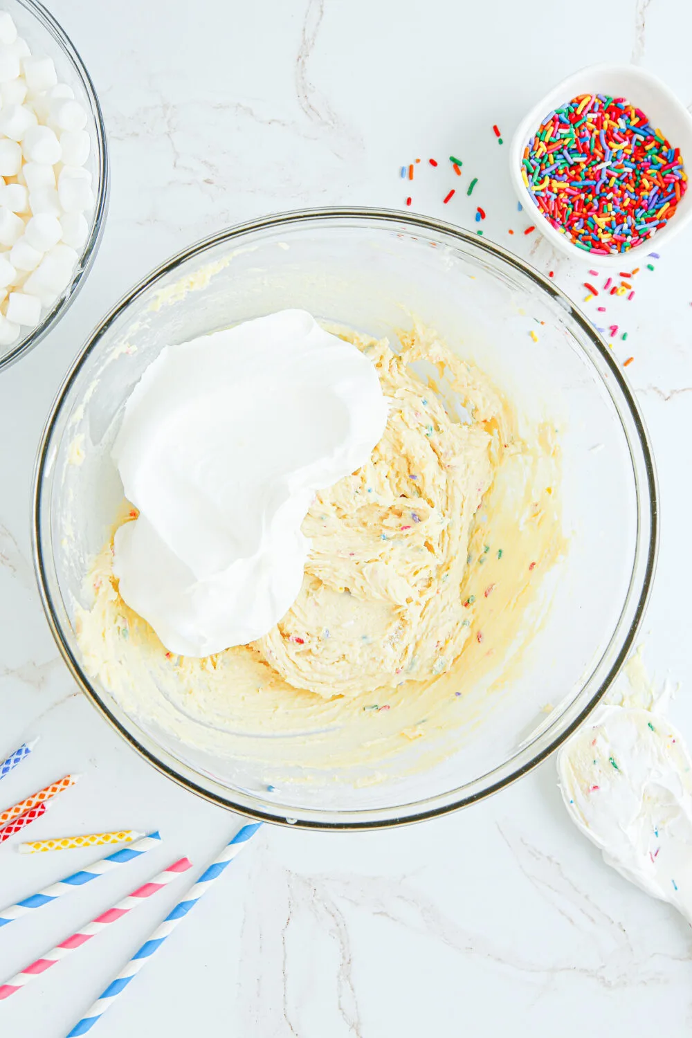 Whipped topping in pudding mixture in a bowl. 