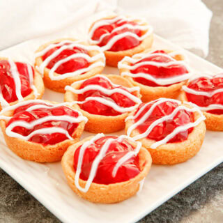 A plate full of cherry pie cookies.