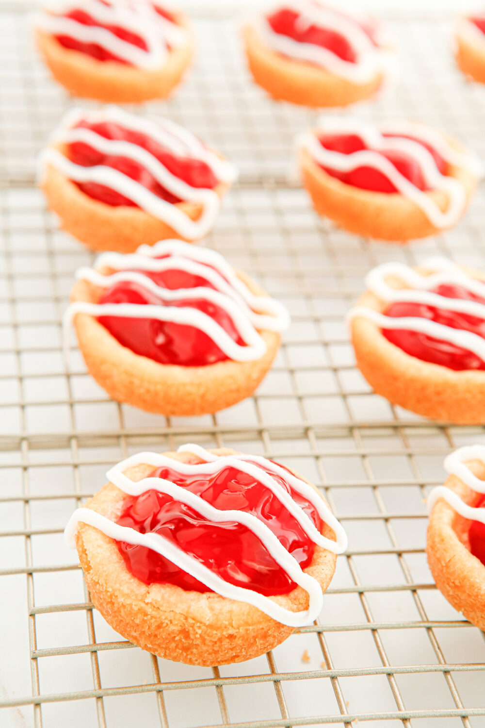 Glaze on top of cherry pie cookies. 