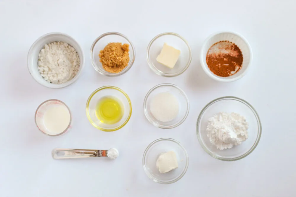 Ingredients for microwave cinnamon roll cake in bowls.